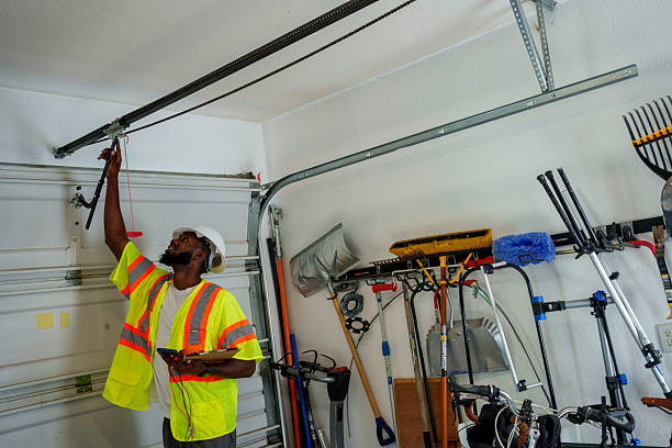 Professional Garage Door Panel Replacement technician working in East Camden, AR